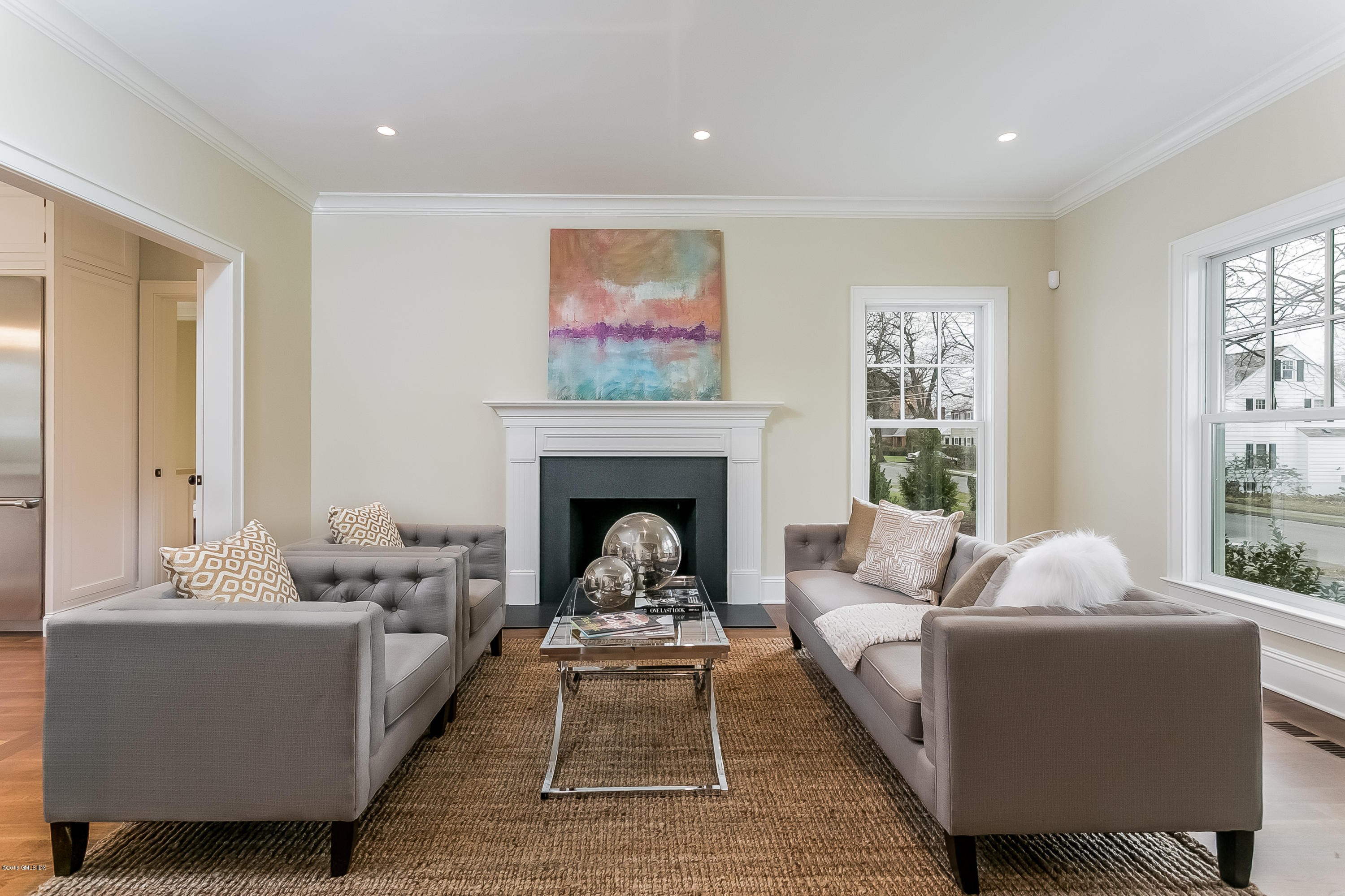 13 Perryridge Road Greenwich, CT 06830 - Photo 3 of 25 a living room with furniture and a fireplace