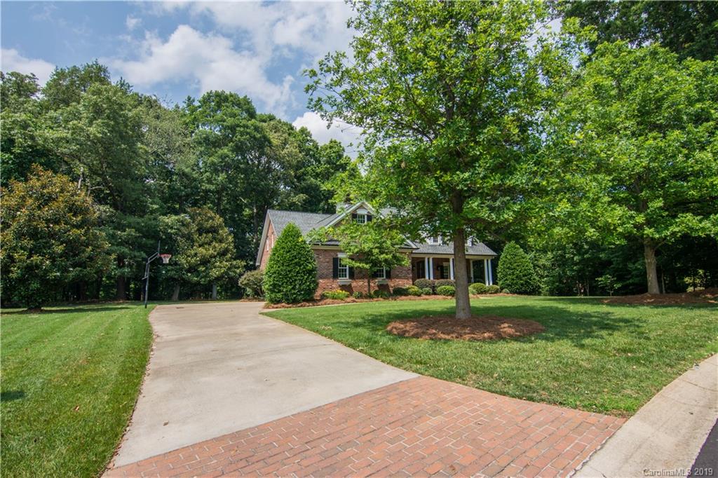 6695 Fox Ridge Circle Davidson, NC 28036 - Photo 3 of 42 a front view of a house with a yard