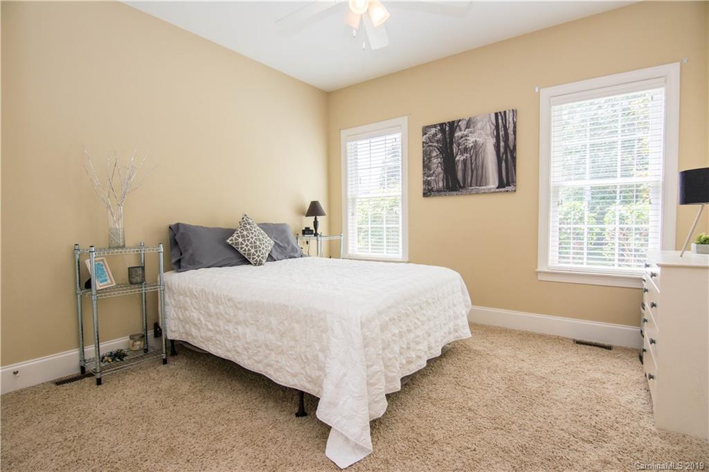6695 Fox Ridge Circle Davidson, NC 28036 - Photo 22 of 42 a bed sitting in a bedroom next to a window