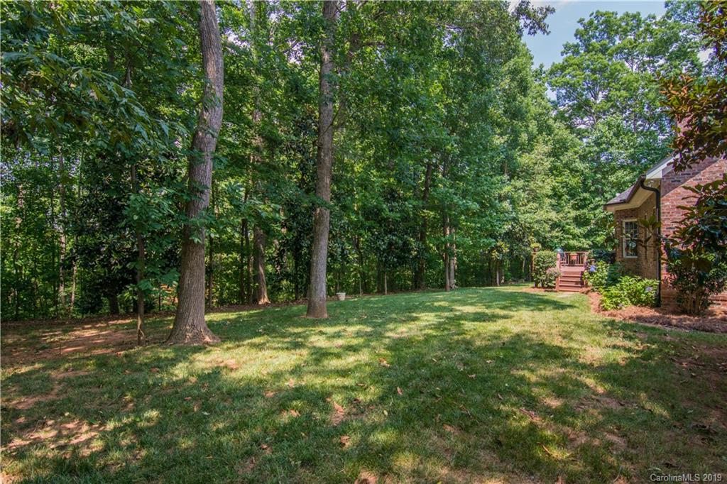 6695 Fox Ridge Circle Davidson, NC 28036 - Photo 40 of 42 a big yard with lots of green space and trees
