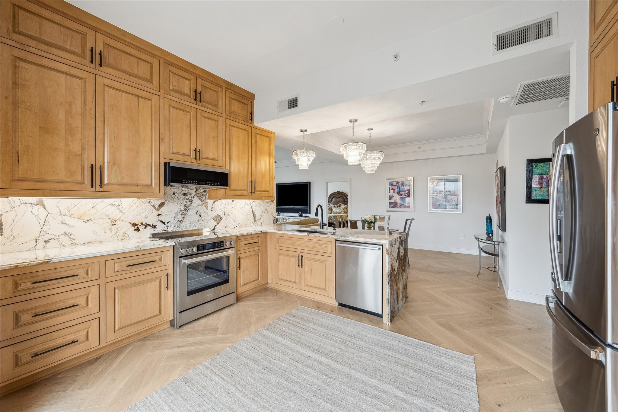 3333 Allen Parkway, Unit 602 Houston, TX 77019 - Photo 6 of 49 a kitchen with granite countertop a sink cabinets stainless steel appliances and a counter space