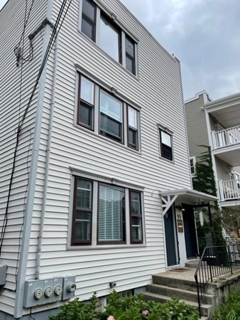 95 Allston Street, Unit 3 Cambridge, MA 02139 - Photo 12 of 12 a view of a house with more windows and brick walls