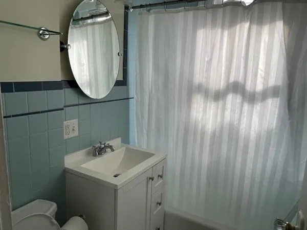 a bathroom with a sink and mirror