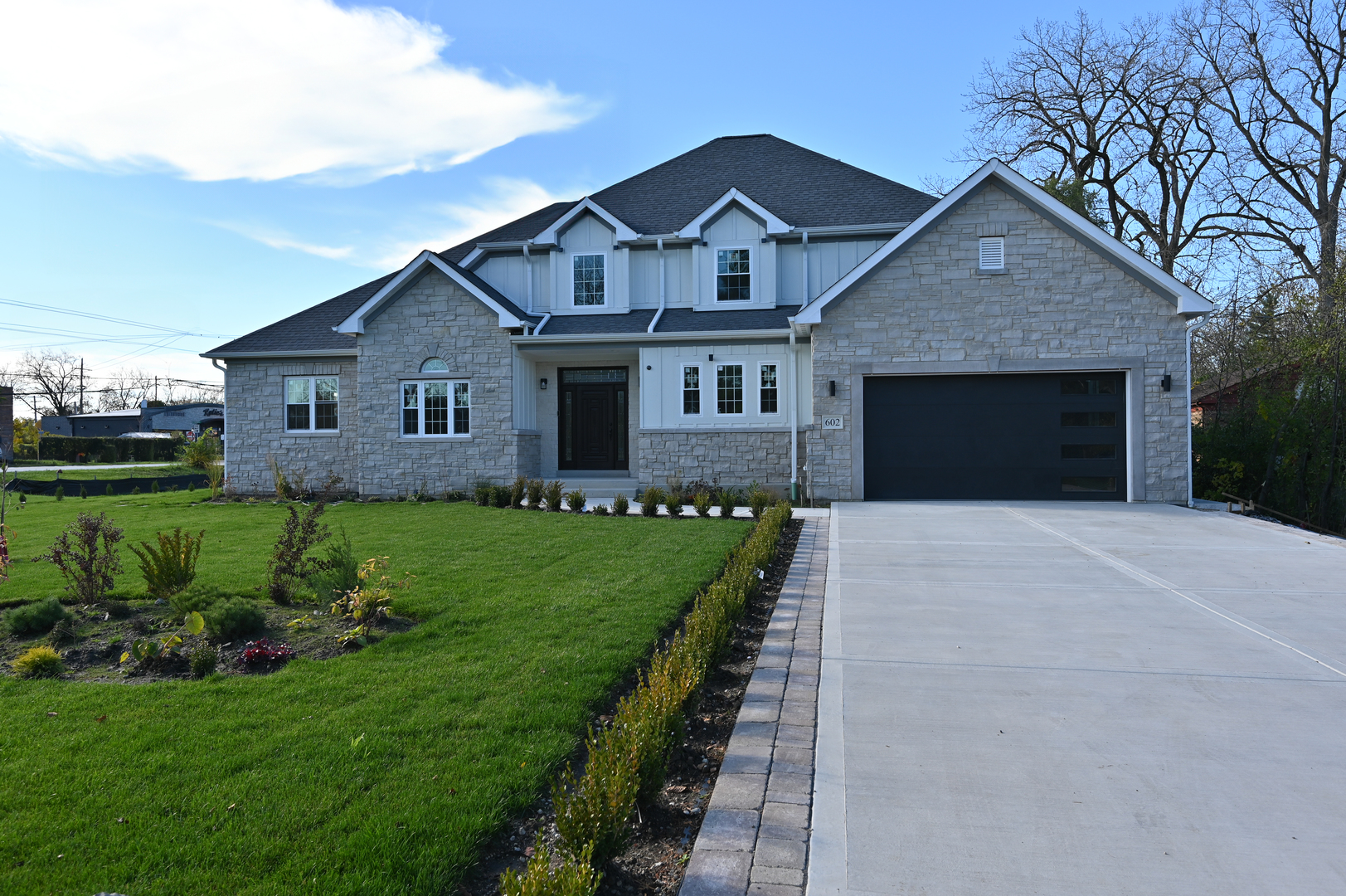 602 Glenshire Road Glenview, IL 60025 - Photo 2 of 98 a front view of a house with a yard and garage