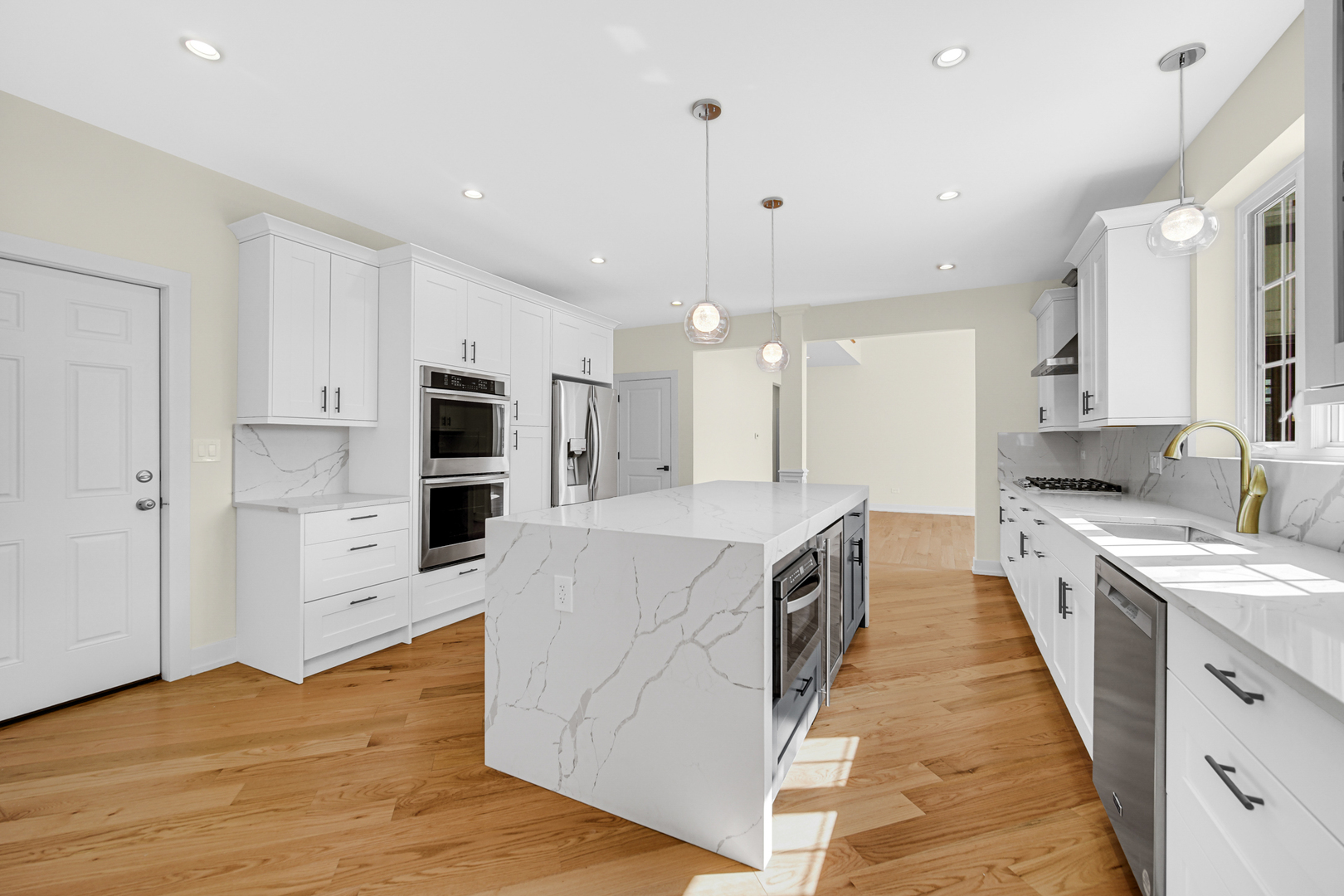 602 Glenshire Road Glenview, IL 60025 - Photo 29 of 98 a large kitchen with stainless steel appliances kitchen island a large counter top and a wooden floors