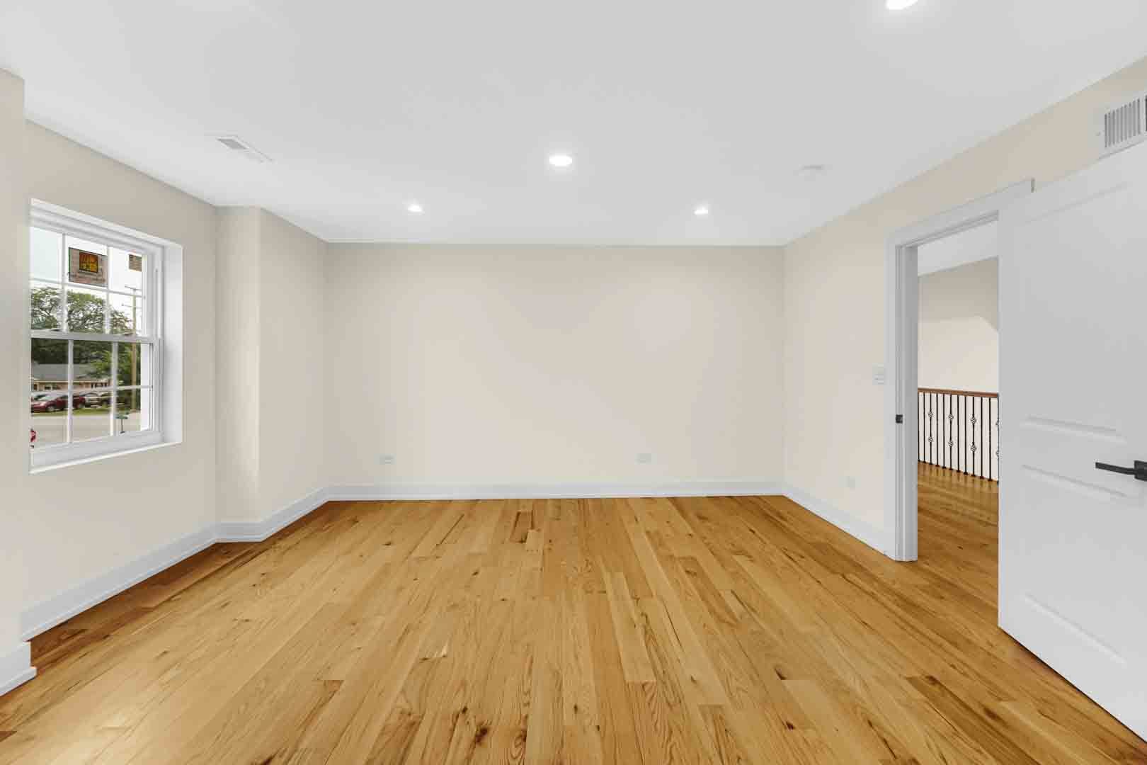 602 Glenshire Road Glenview, IL 60025 - Photo 61 of 98 a view of empty room with wooden floor and fan
