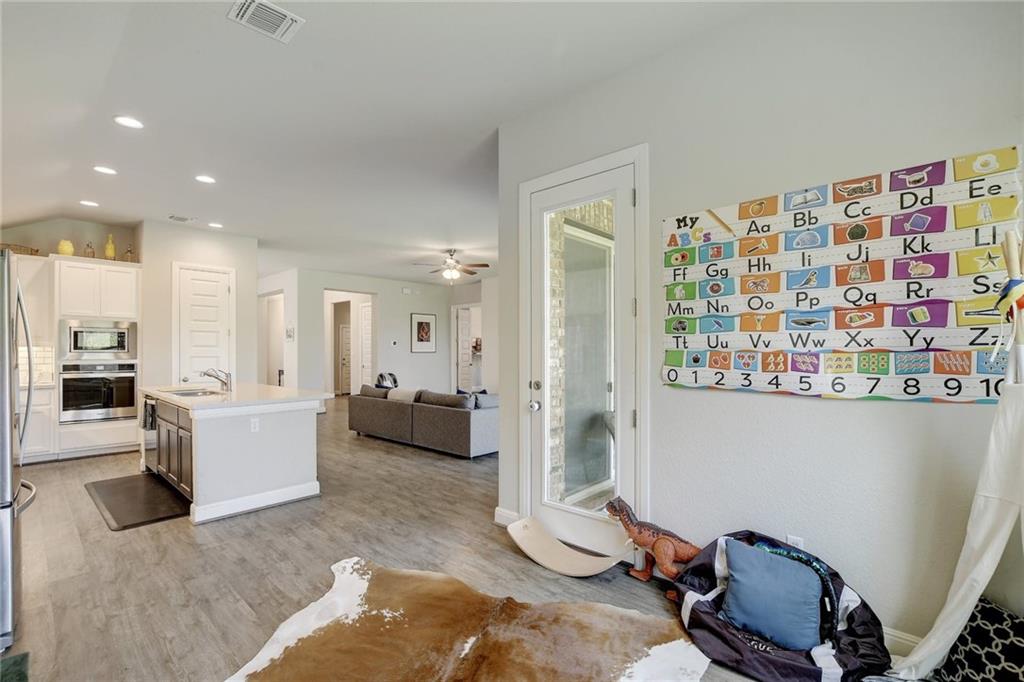 416 Peakside Circle Dripping Springs, TX 78620 - Photo 14 of 31 a living room with furniture and wooden floor