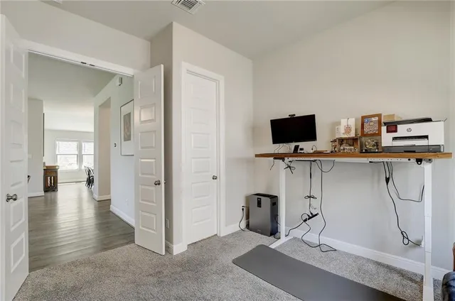 a view of a workspace with furniture