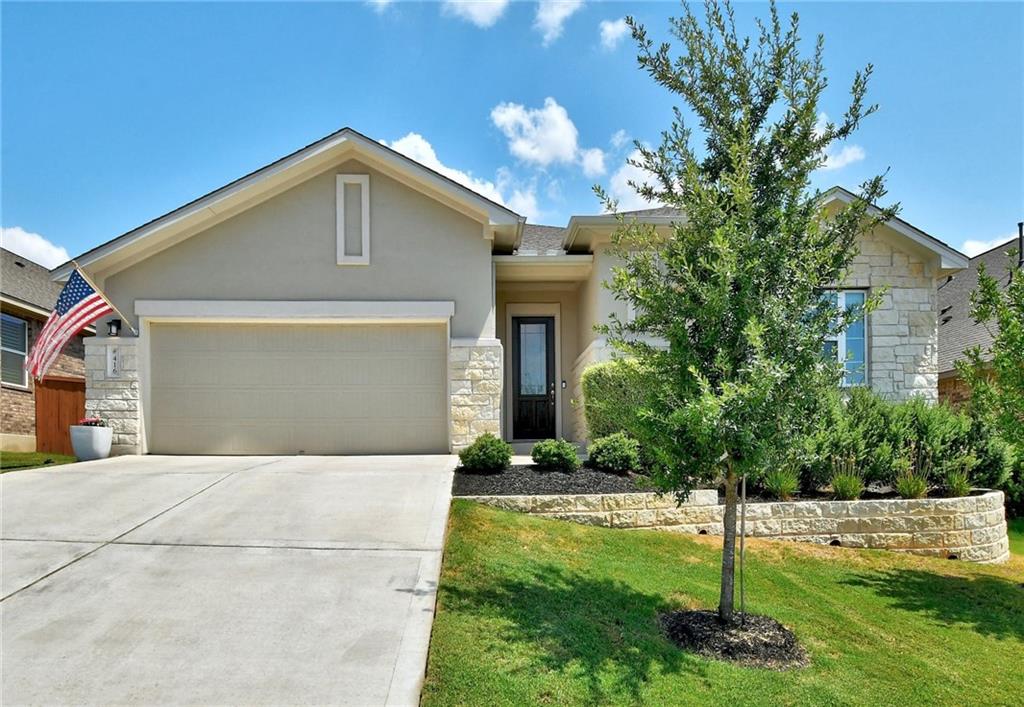 416 Peakside Circle Dripping Springs, TX 78620 - Photo 2 of 31 a front view of a house with a yard