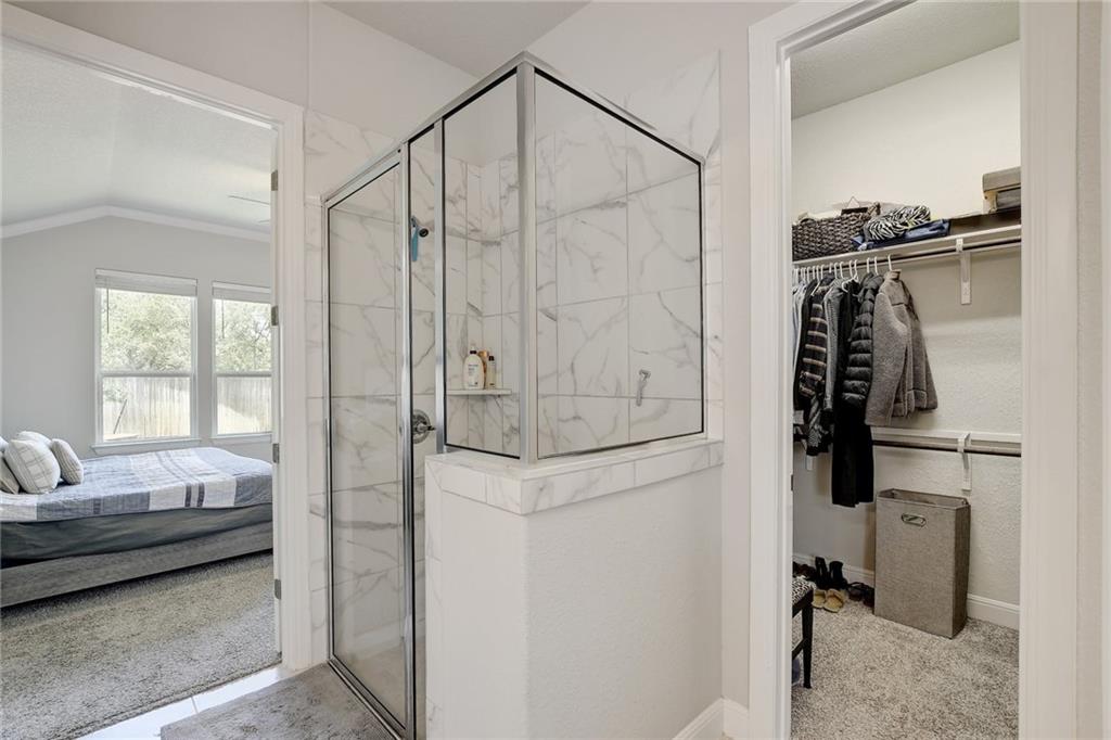 416 Peakside Circle Dripping Springs, TX 78620 - Photo 20 of 31 a bedroom with a bed and a window