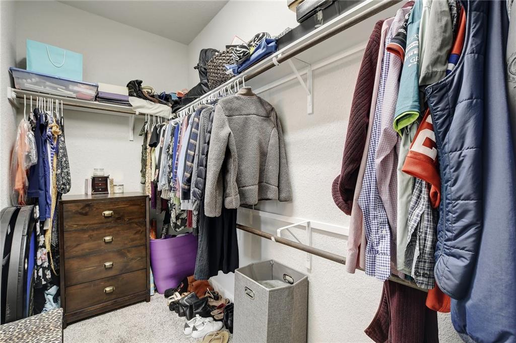 416 Peakside Circle Dripping Springs, TX 78620 - Photo 21 of 31 a view of walk in closet with clothes and shoes