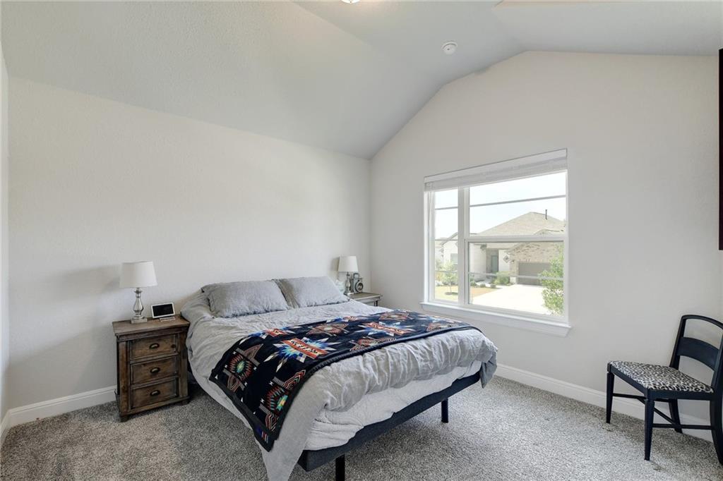 416 Peakside Circle Dripping Springs, TX 78620 - Photo 23 of 31 a bedroom with a bed and a window
