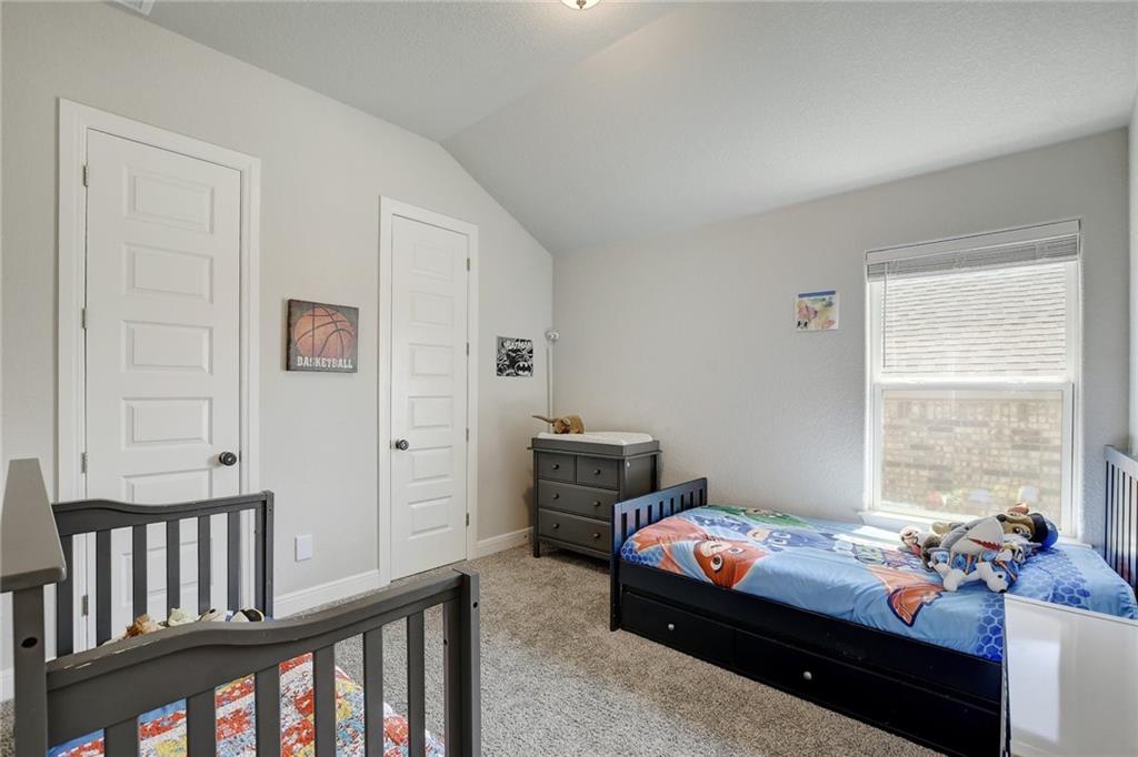 416 Peakside Circle Dripping Springs, TX 78620 - Photo 25 of 31 a bedroom with furniture and a window