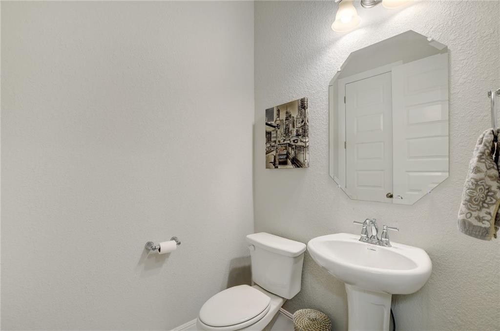 416 Peakside Circle Dripping Springs, TX 78620 - Photo 27 of 31 a bathroom with a sink mirror and toilet