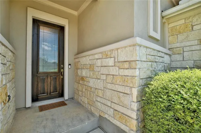 a living room with furniture ceiling fan and a window