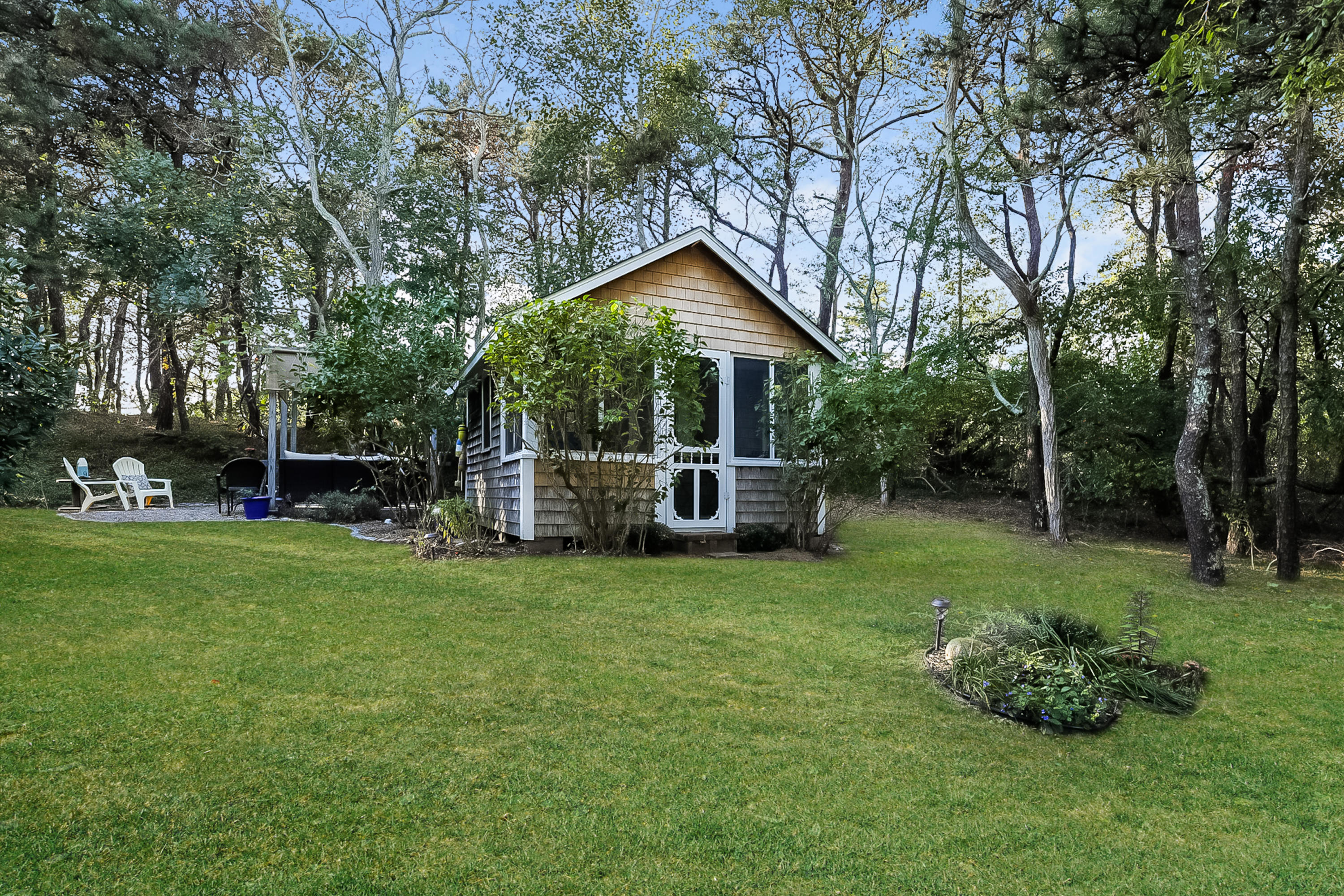 82 Shore Road, Unit 9 Truro, MA 02666 - Photo 1 of 20 a view of a house with backyard and garden