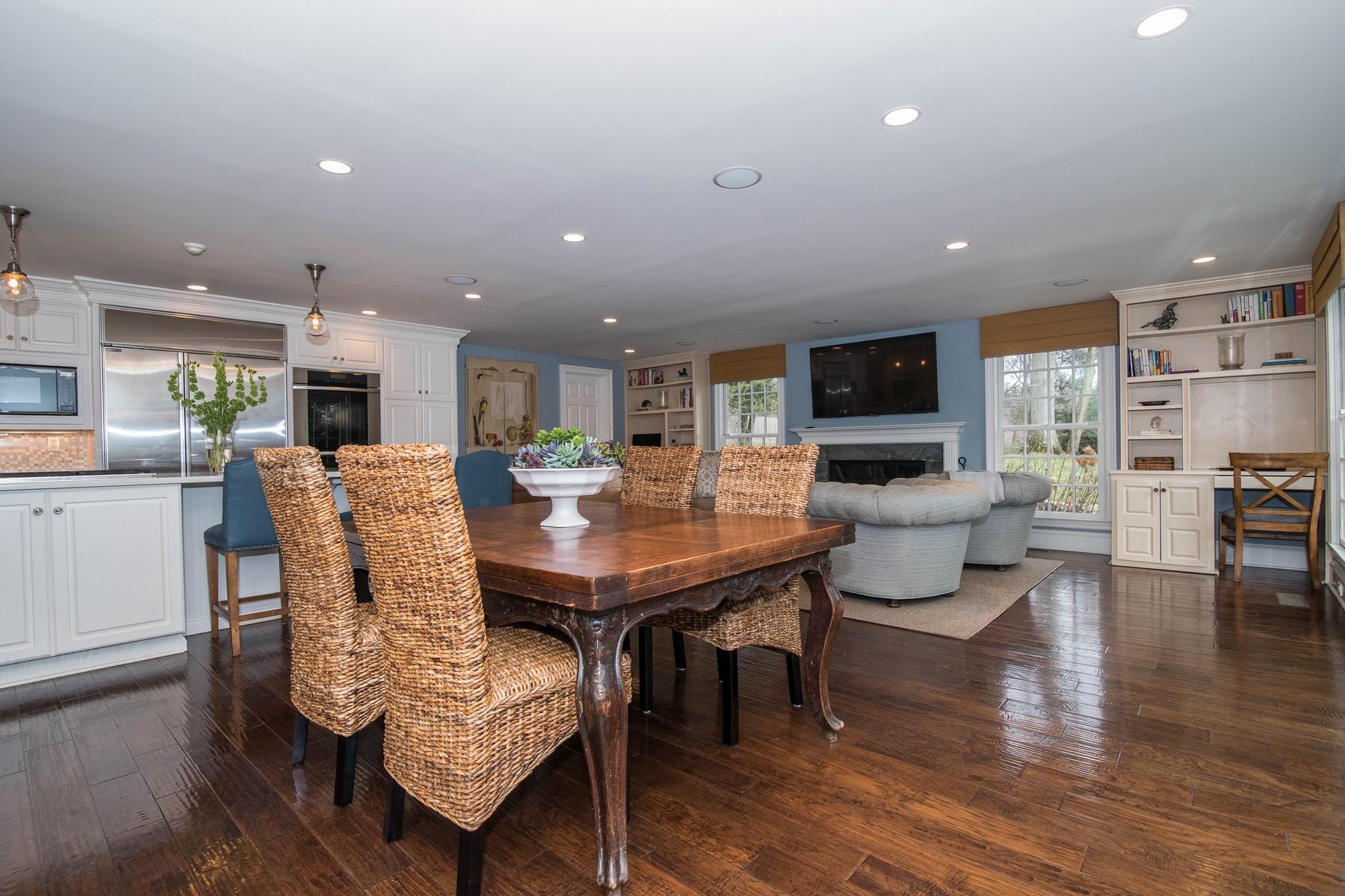 142 Brookside Road Darien, CT 06820 - Photo 11 of 25 a living room with furniture a dining table and chairs