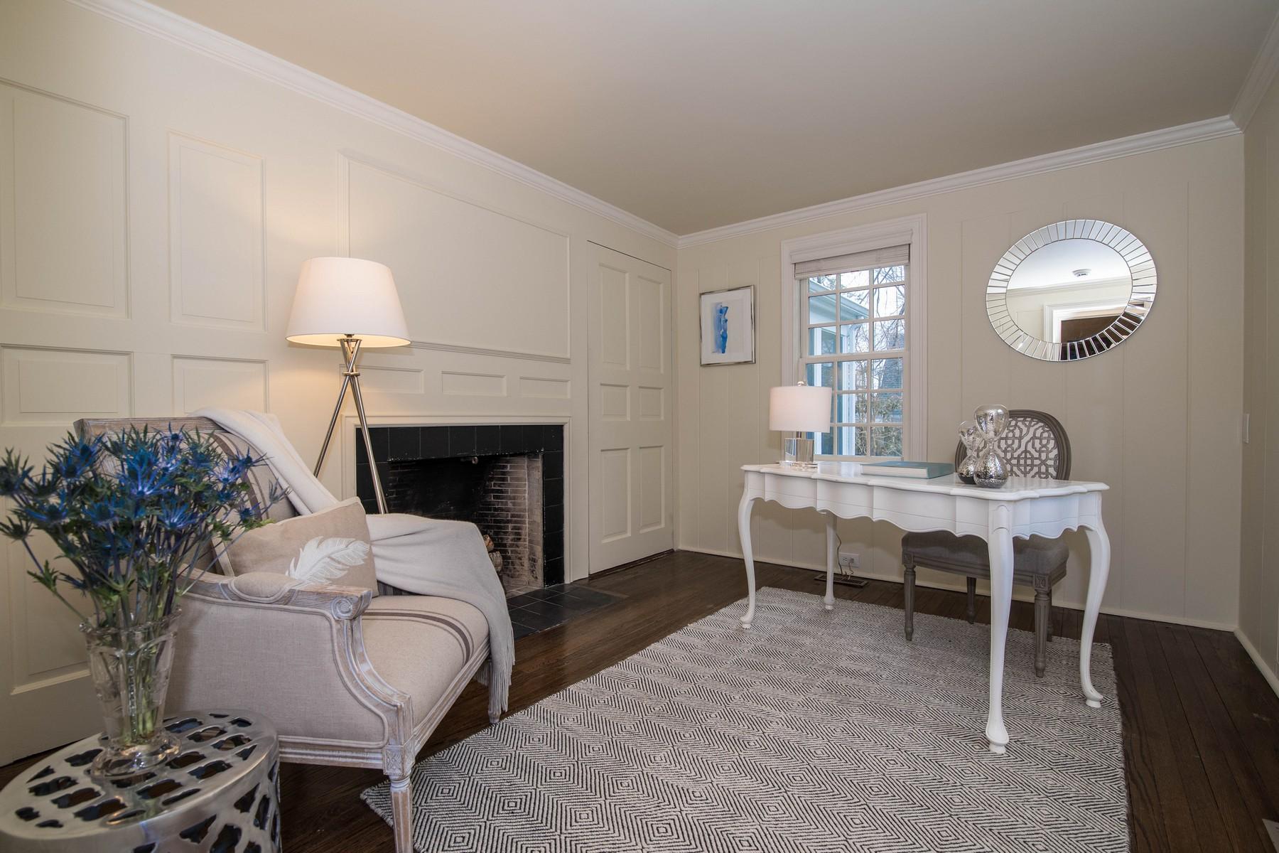 142 Brookside Road Darien, CT 06820 - Photo 13 of 25 a living room with furniture a table and a fireplace