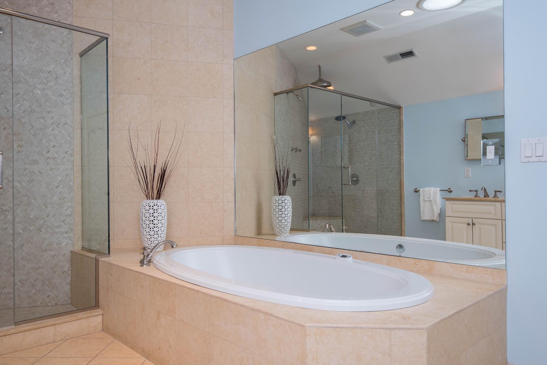 142 Brookside Road Darien, CT 06820 - Photo 15 of 25 a bathroom with a tub a sink and mirror