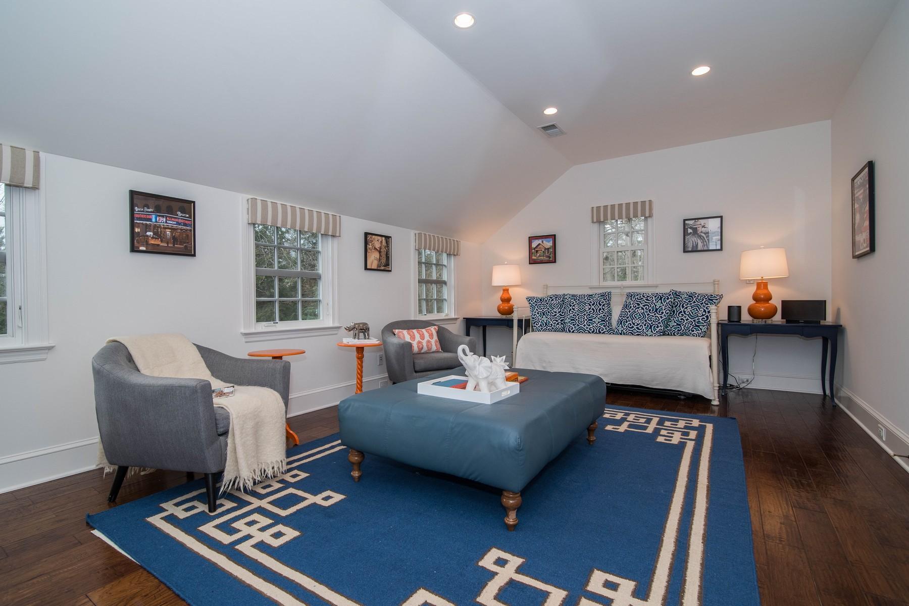 142 Brookside Road Darien, CT 06820 - Photo 19 of 25 a living room with furniture a rug and a window