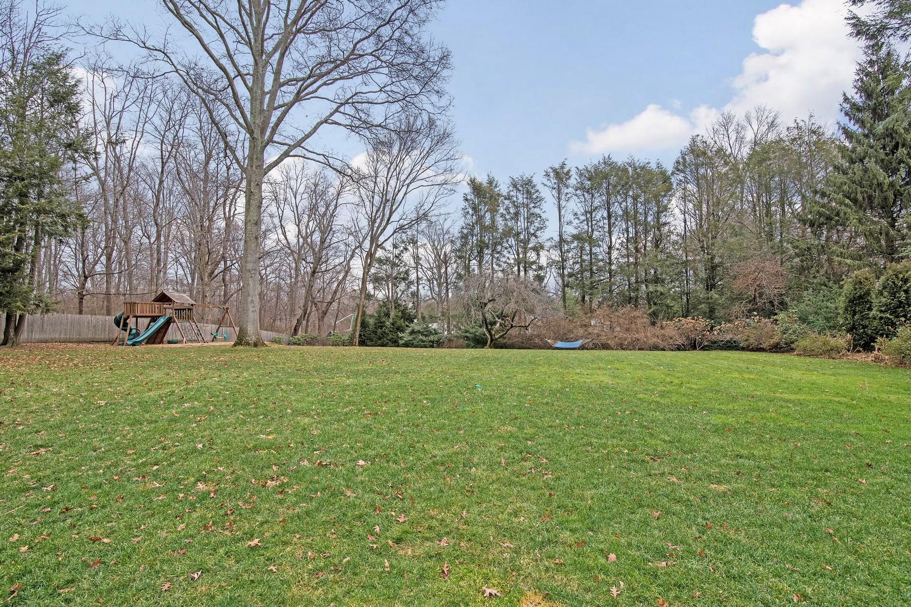 142 Brookside Road Darien, CT 06820 - Photo 2 of 25 a view of a field of grass and trees