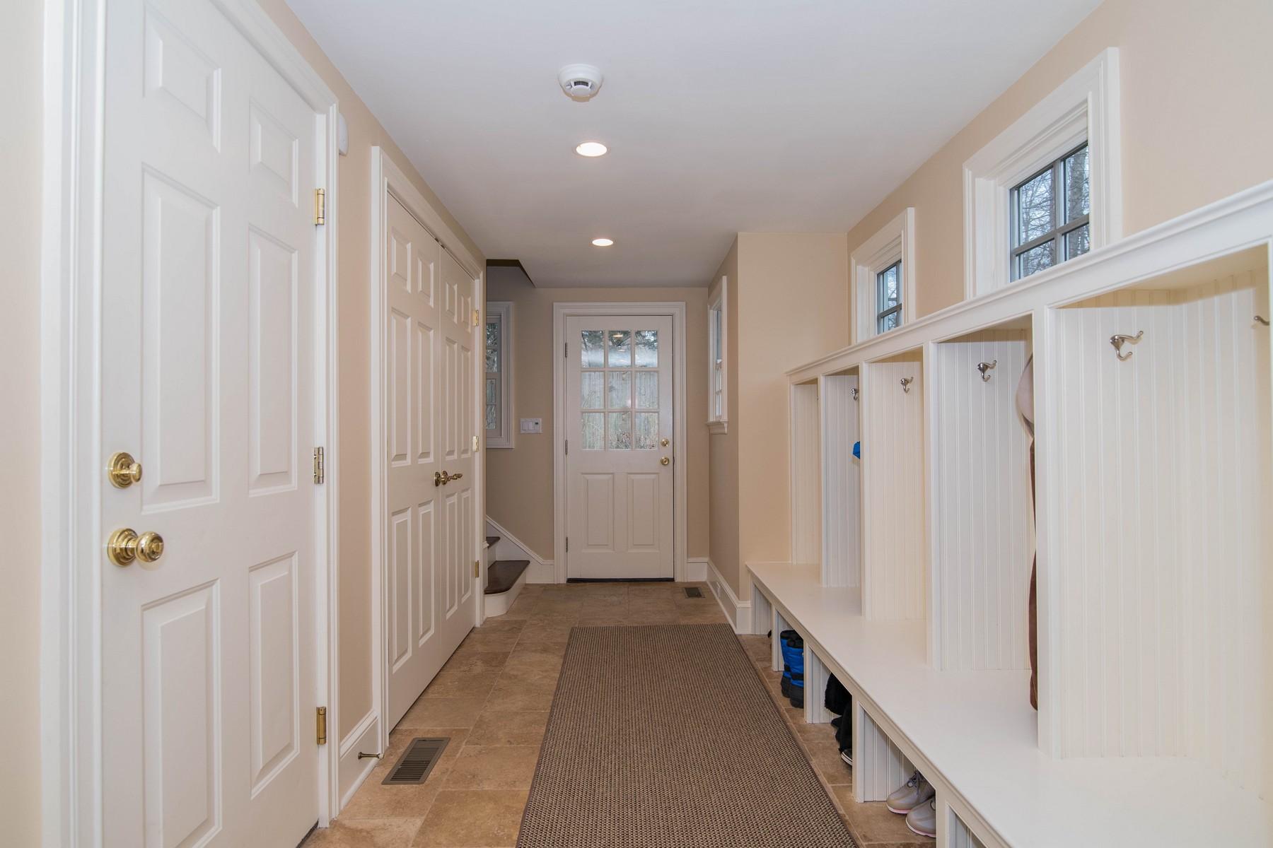 142 Brookside Road Darien, CT 06820 - Photo 22 of 25 a view of a hallway with a white walls and stairs