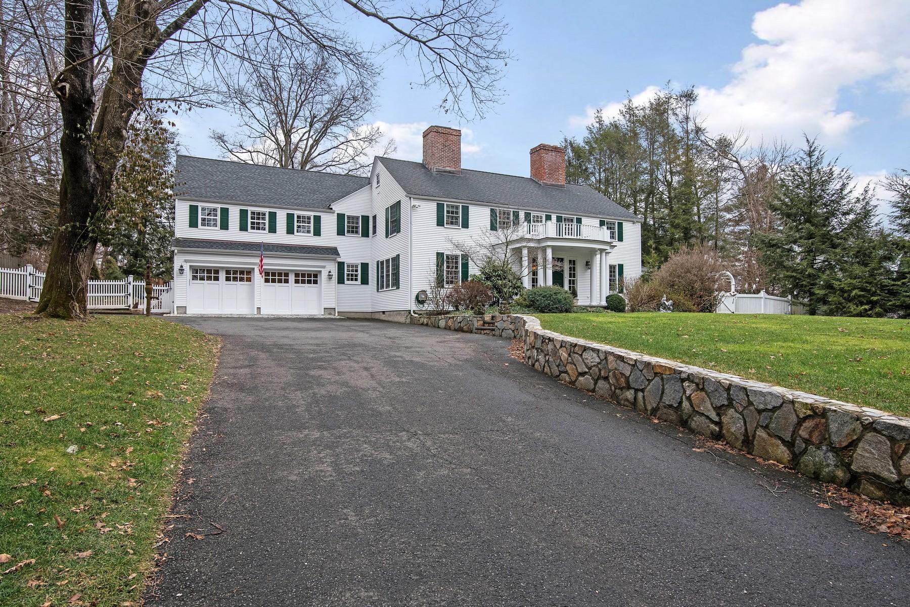 142 Brookside Road Darien, CT 06820 - Photo 25 of 25 a front view of a building with a garden