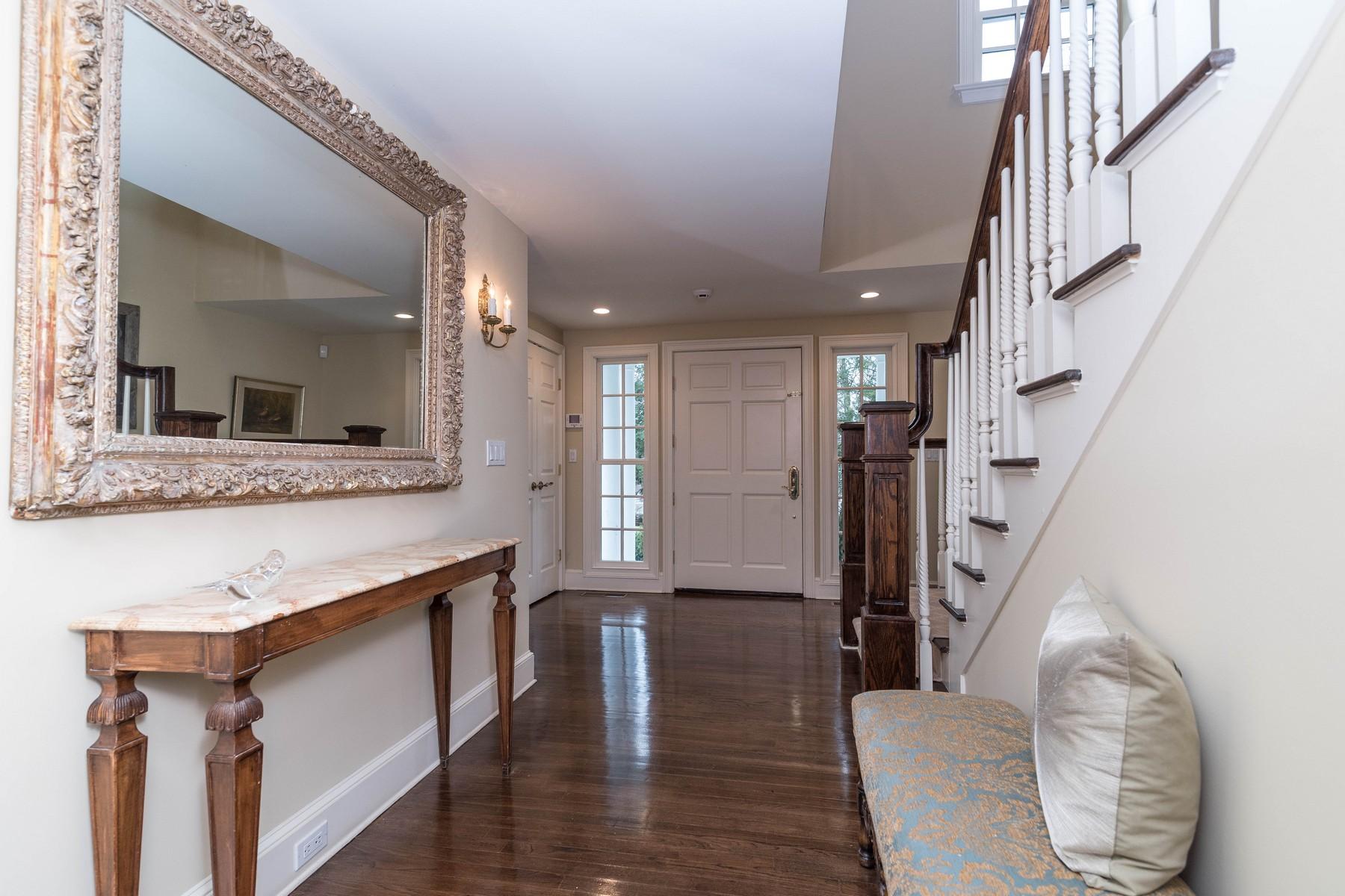 142 Brookside Road Darien, CT 06820 - Photo 3 of 25 a view of entryway and kitchen with wooden floor