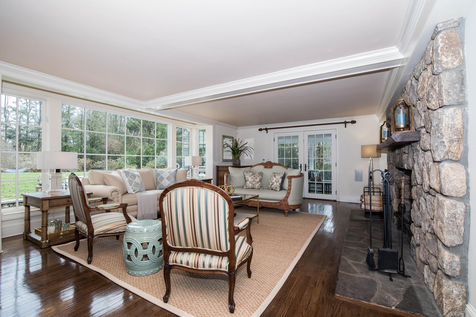 142 Brookside Road Darien, CT 06820 - Photo 4 of 25 a living room with furniture and a large window