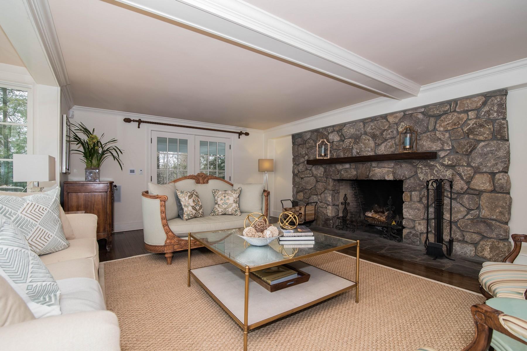 142 Brookside Road Darien, CT 06820 - Photo 5 of 25 a living room with furniture and a fireplace