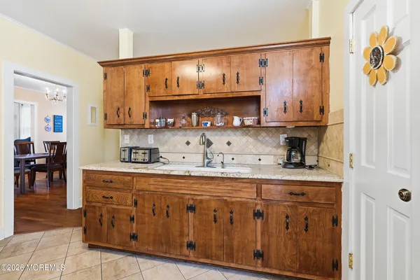 a kitchen with stainless steel appliances granite countertop a sink and cabinets