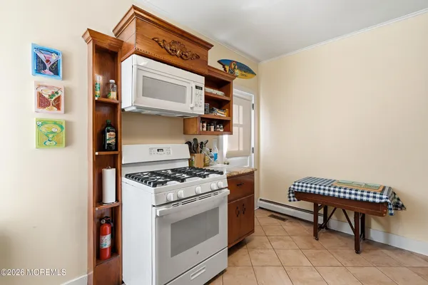 a kitchen with stainless steel appliances cabinets and a stove