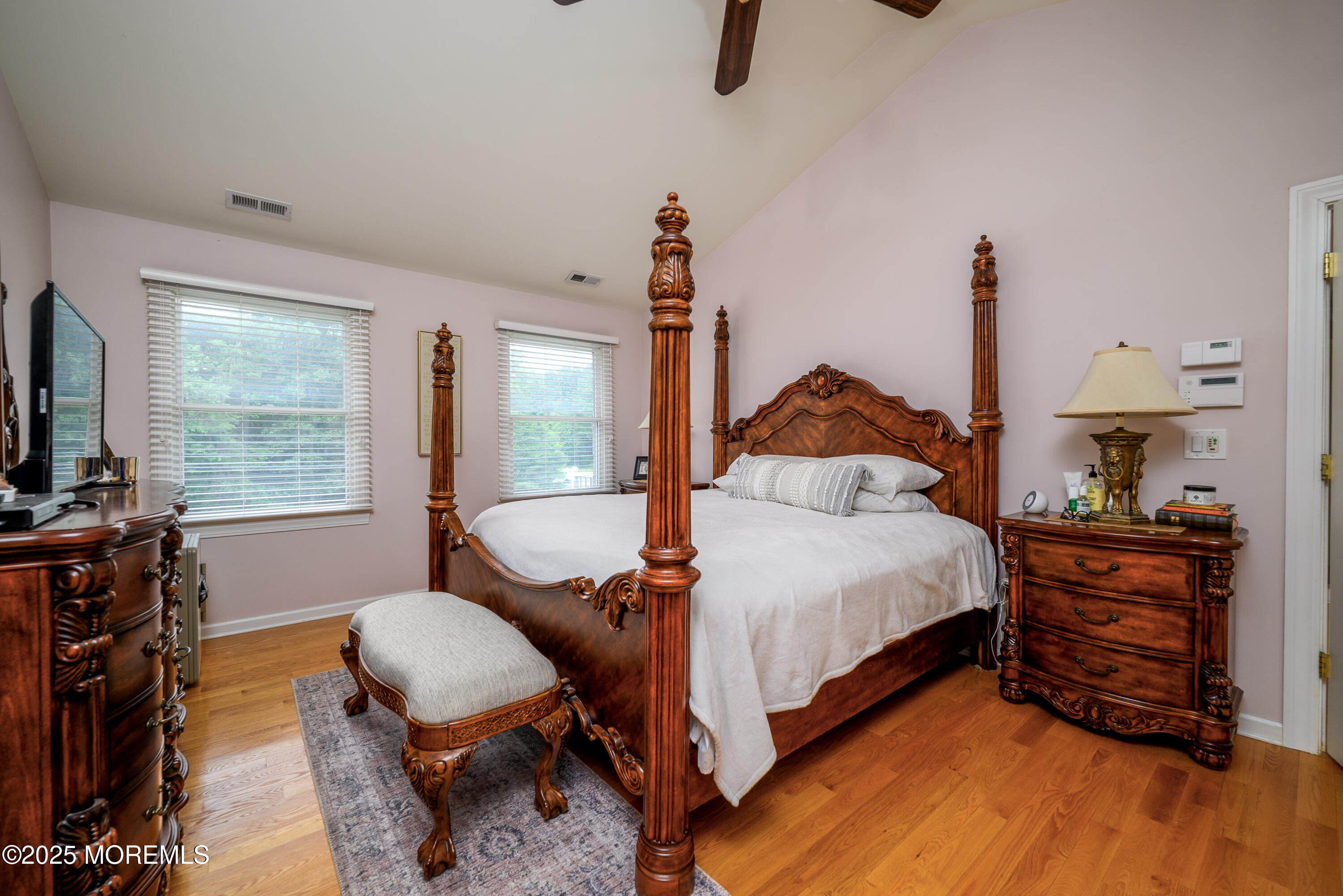 235 Leesville Road Jackson, NJ 08527 - Photo 27 of 54 a bedroom with a bed and wooden floor