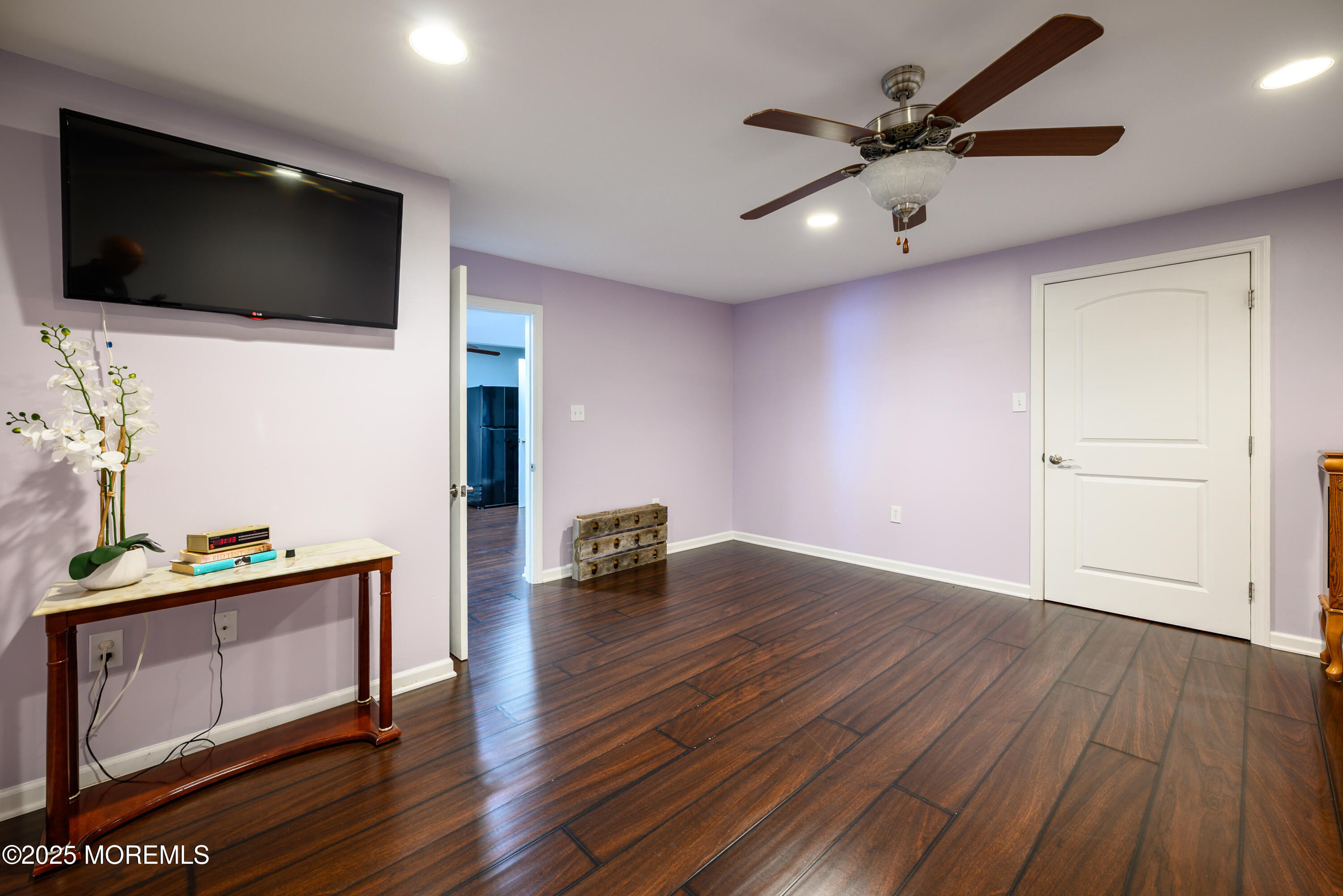 235 Leesville Road Jackson, NJ 08527 - Photo 35 of 54 a view of a livingroom with a flat screen tv