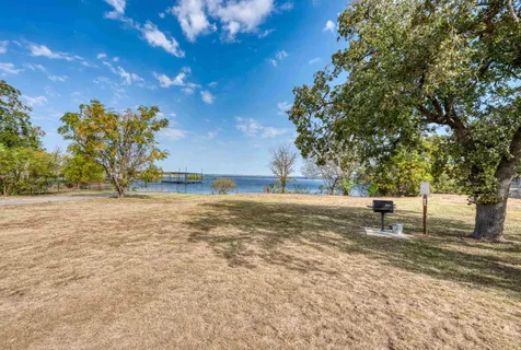 a view of yard with large trees