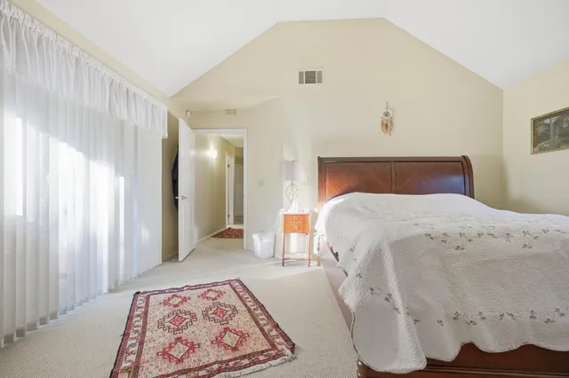 a swimming pool with outdoor seating and yard