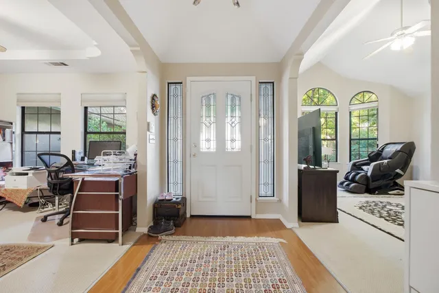 a view of a livingroom with furniture and windows