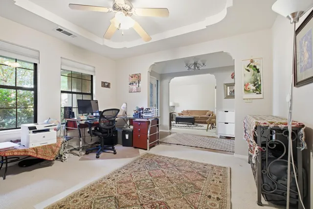 a bedroom with furniture and a rug