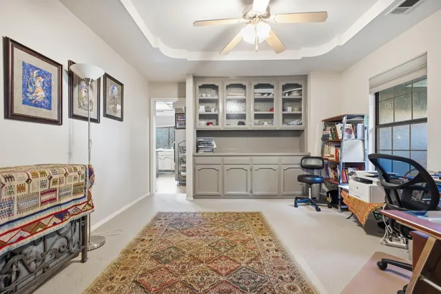 a bathroom with a sink vanity mirror and toilet