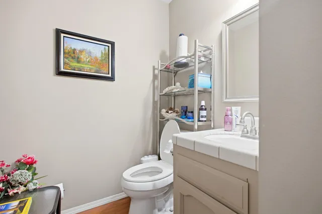 a kitchen with stainless steel appliances a sink window and cabinets