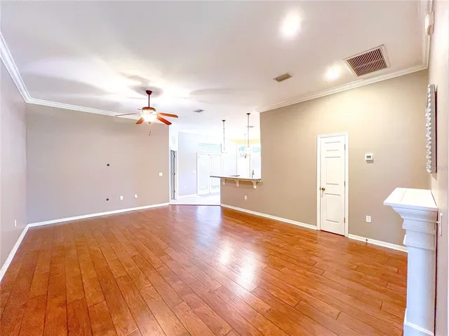 a view of a livingroom with wooden floor