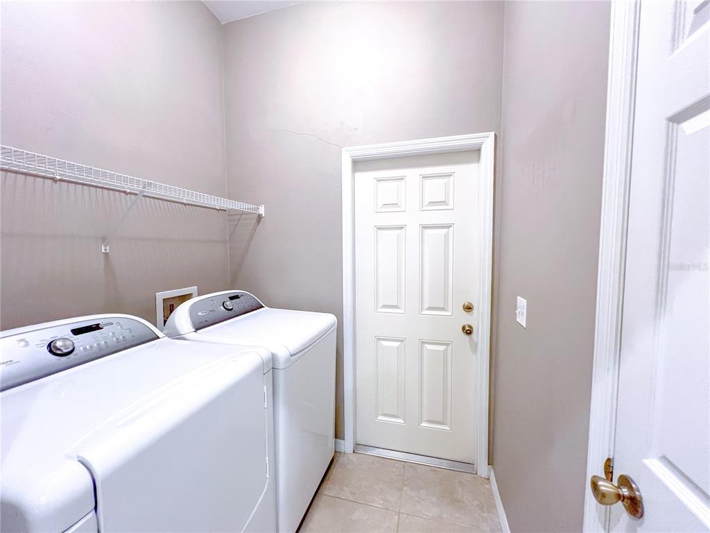 14479 Northwest 25th Road Newberry, FL 32669 - Photo 8 of 15 a utility room with dryer and washer