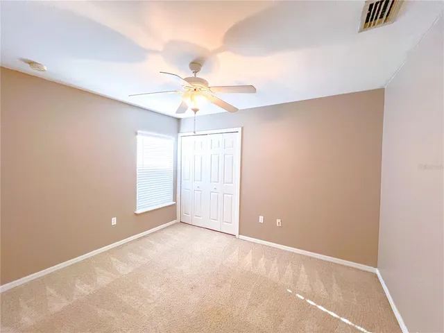 a bathroom with a granite countertop sink a toilet and bathtub