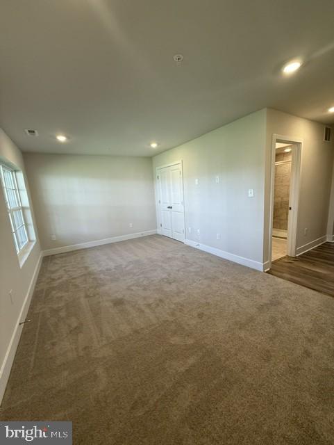 7608 River Reach Road Baltimore, MD 21244 - Photo 3 of 14 an empty room with windows and entrance