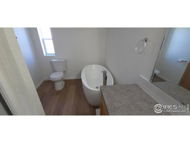 a bathroom with a toilet and a sink