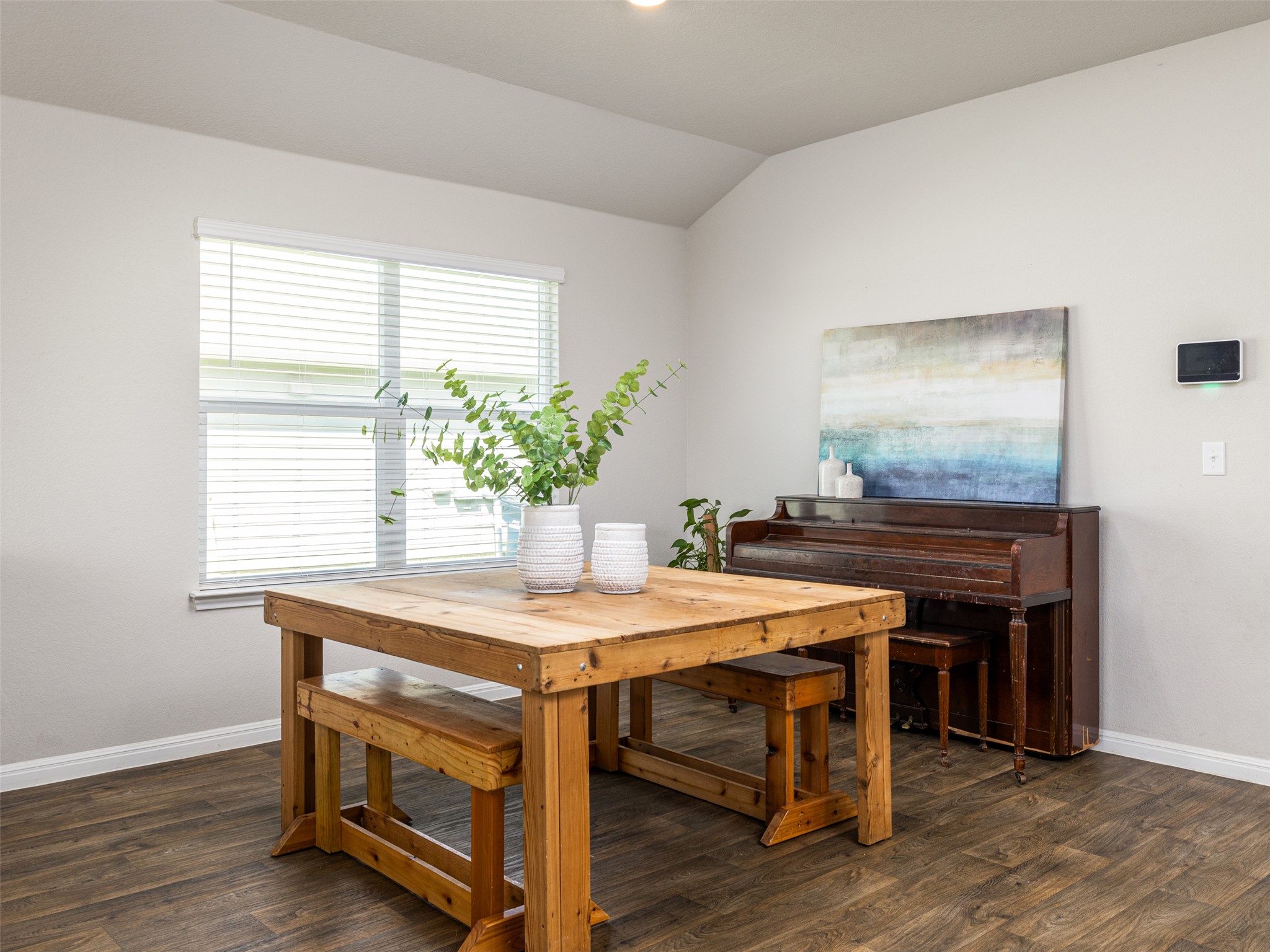 439 Hunter Loop Bertram, TX 78605 - Photo 11 of 23 A window-filled dining area provides a perfect space for gathering or a home office setup.
