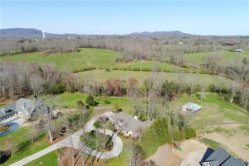 5887 Sun Ridge Court Clermont, GA 30527 - Photo 1 of 1 3.568 acres with over 700 feet of Little River frontage, fenced pasture and a 3 stall barn.
