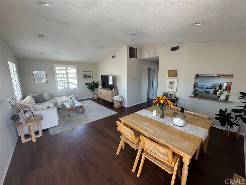 218 Ogle Street, Unit B Costa Mesa, CA 92627 - Photo 2 of 11 a living room with furniture rug and a window