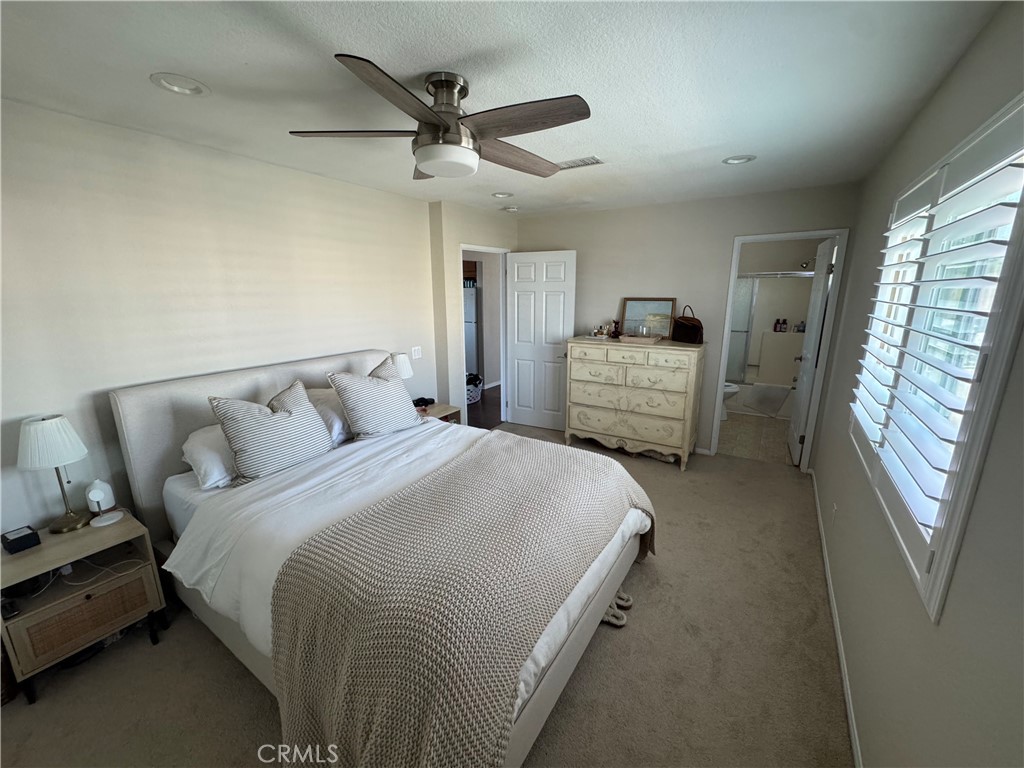 218 Ogle Street, Unit B Costa Mesa, CA 92627 - Photo 6 of 11 a bedroom with a bed and a large window