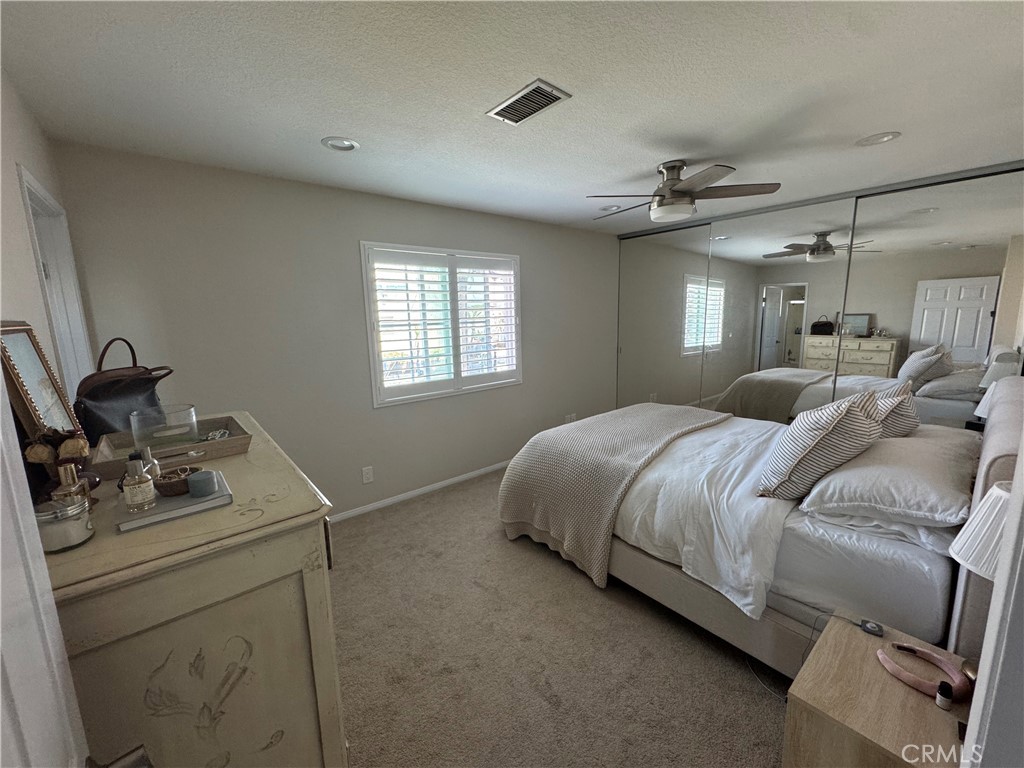 218 Ogle Street, Unit B Costa Mesa, CA 92627 - Photo 7 of 11 a bedroom with a bed and window